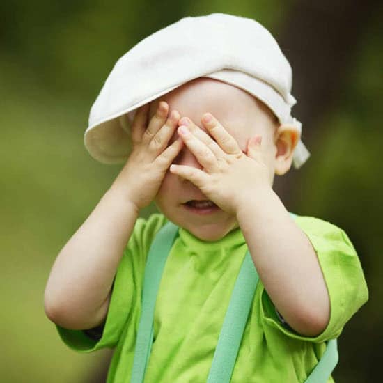Child covering eyes